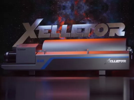 The Xelletor decanter centrifuge in an advertising image with a space atmosphere.