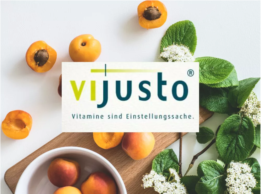 A photo of apricots and herbs with the vijusto logo superimposed. 